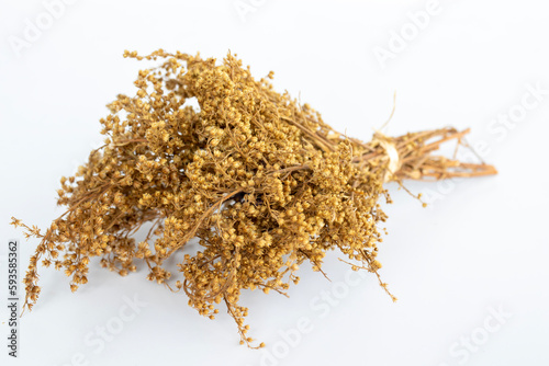 bunch of dried highland flowers. golden flower. white background.