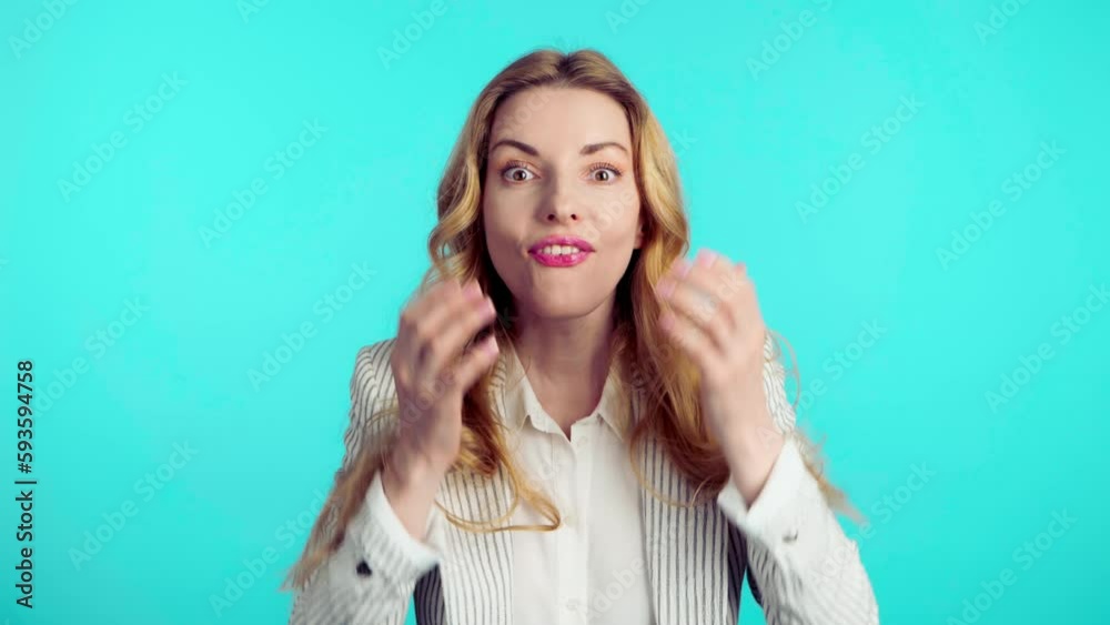 Surprised young woman hands up wonder, shocked. Wow! Blonde businesswoman amazed excited by success, win, surprise emotion. Oh my god expression! Indoor studio shot isolated on blue background Surprised young woman hands up wonder, shocked. Wow! Blonde businesswoman amazed excited by success, win, surprise emotion. Oh my god expression! Indoor studio shot isolated on blue background
