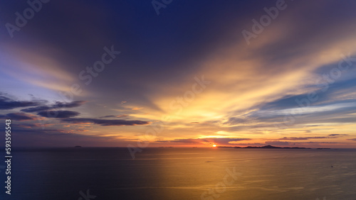 Dreamy sunset on tropical sea in Pattaya, Thailand. beautiful landscape of seascape with water reflection from sunlight. background for traveling and vacation. © bigy9950