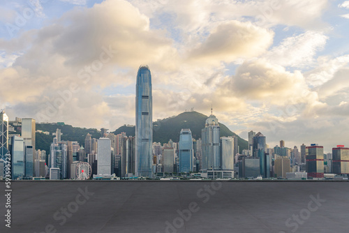 cityscape and skyline of Hong Kong city at Victoria Harbour on view from empty concrete floor. © bigy9950