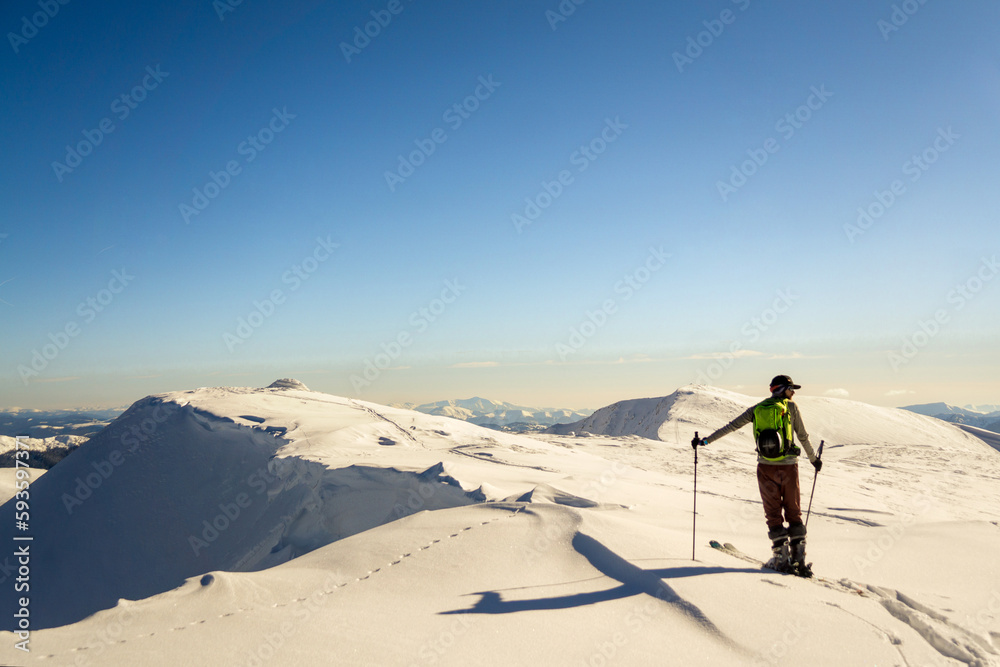 Skier is looking for his line