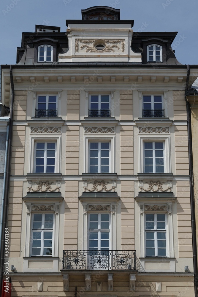 Closeup view of the facade of an adorned historical building in downtown Warsaw