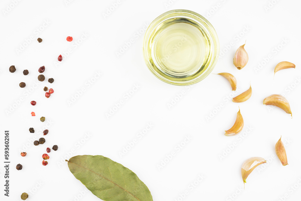 Spices, olive oil, bay leaf isolated on a white background.
