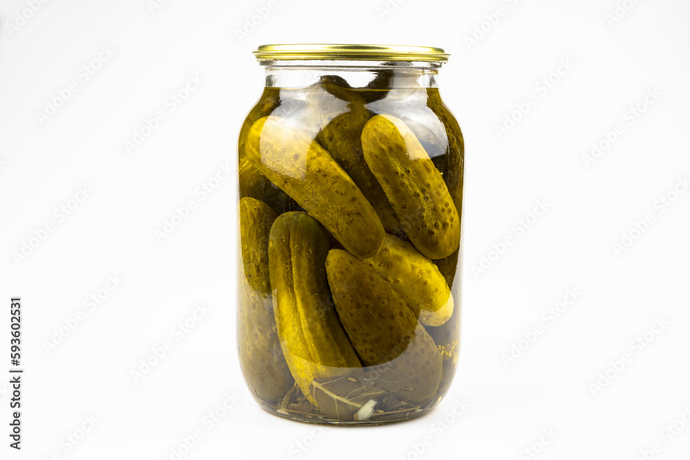 Glass jar with canned cucumbers isolated on a white background. Glass jar with canned cucumbers isolated on a white background.