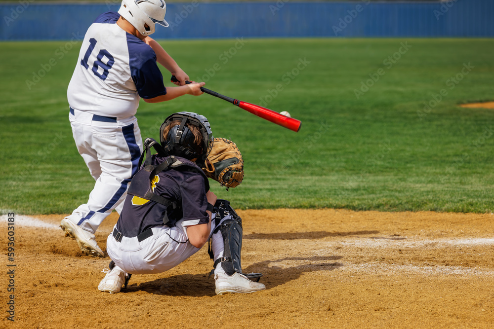 Baseball Player - Batter hitting the ball. Catcher ready at the plate Baseball Player - Batter hitting the ball. Catcher ready at the plate