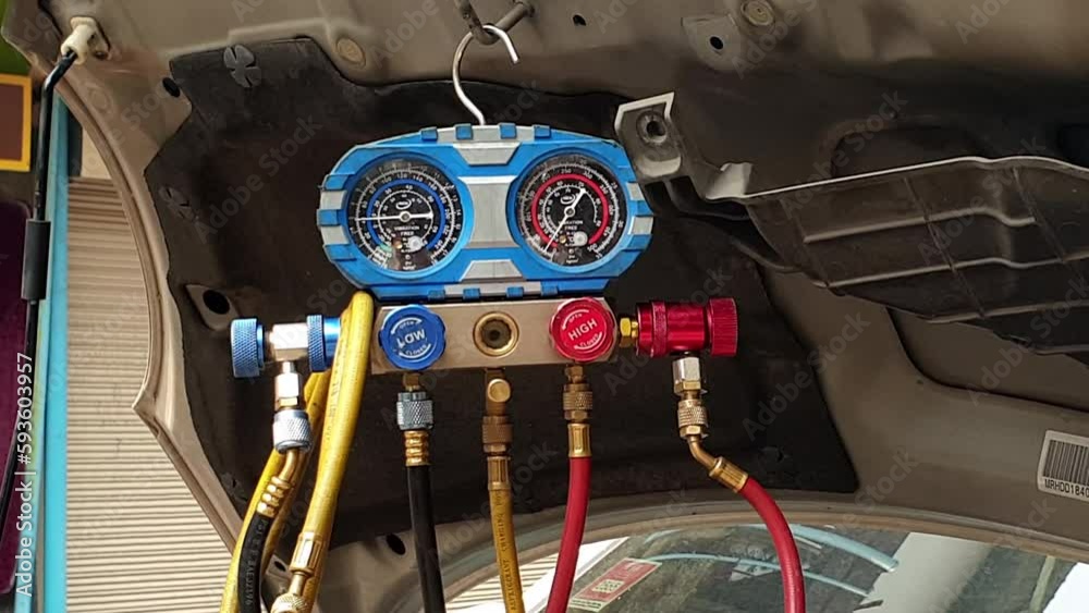 Repair garage checking for air AC compressor cooling system leaking