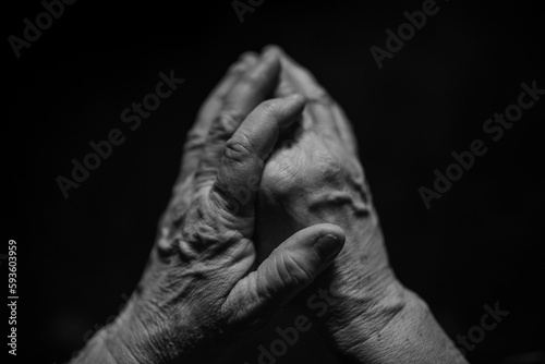 Close up of wrinkled hands, black and white.