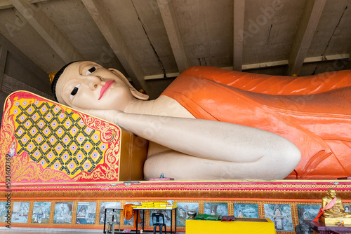Closeup of the Reclining or Sleeping Buddha in Wat Phothivihan, Tumpat Kelantan, Malaysia photo
