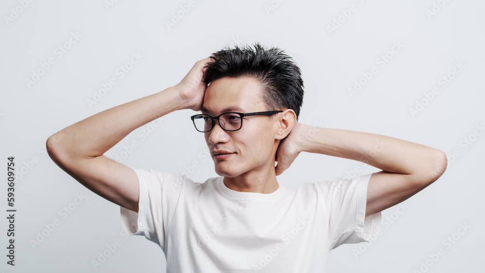 Young confident asian chinese young man checking hair style and dandruff. Young confident asian chinese young man checking hair style and dandruff.