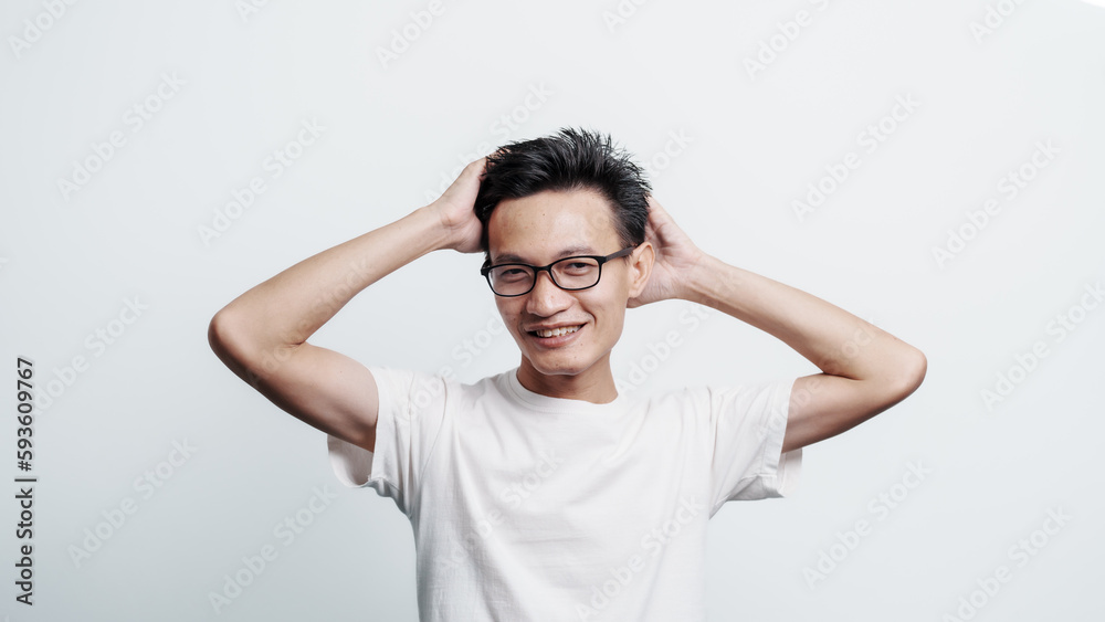 Young confident asian chinese young man checking hair style and dandruff. Young confident asian chinese young man checking hair style and dandruff.