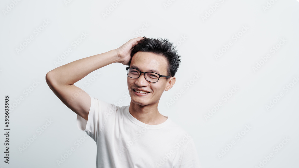 Young confident asian chinese young man checking hair style and dandruff. Young confident asian chinese young man checking hair style and dandruff.