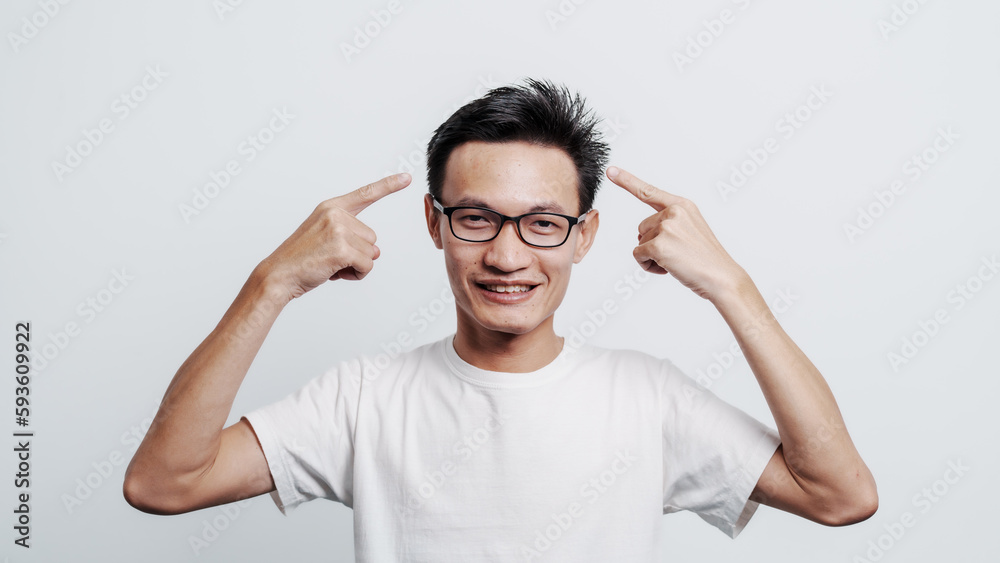 Young confident asian chinese young man checking hair style and dandruff. Young confident asian chinese young man checking hair style and dandruff.