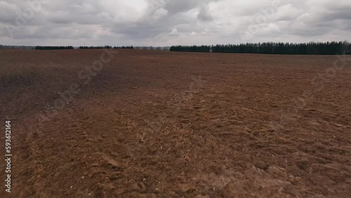 Cloudy sky plowed field landscape spring season