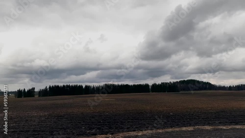 Cloudy sky plowed field landscape spring season