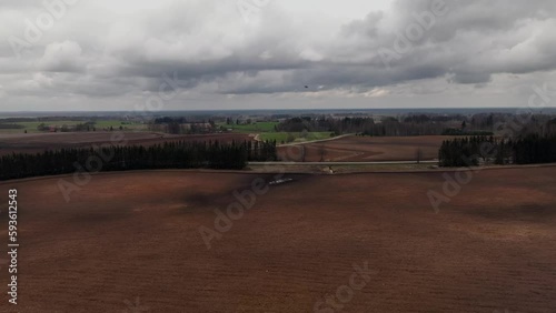 Cloudy sky plowed field landscape spring season