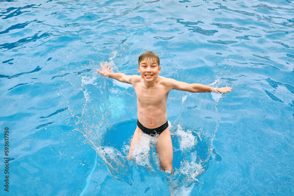 Child jump, swim in the pool, sunbathes, swimming in hot summer day. Relax, Travel, Holidays
