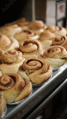 freshly baked cinnamon roll, being displayed on bakery or pastry shop, very delicious and fresh