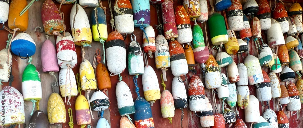 Obraz premium A collection of colorful marine floats hanging on a wall.