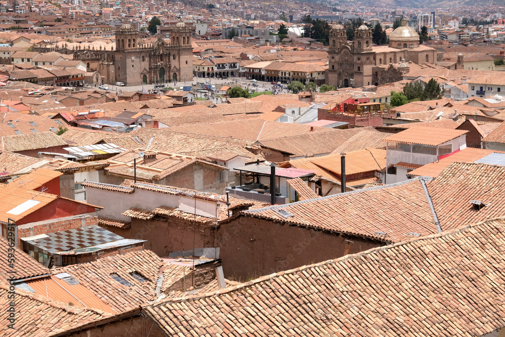 Top view houses and roof at Cusco with Andes mountains and cloudy sky background. Cusco view travel concept background. Open space area.