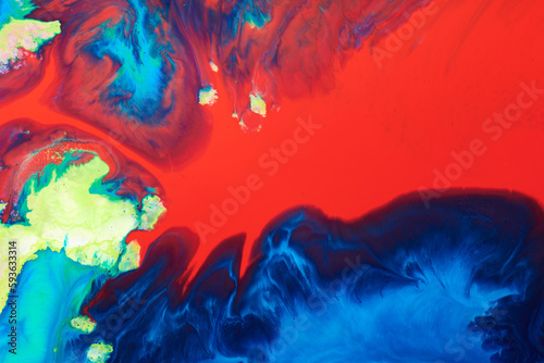 Abstract creative background liquid art, contrast paint stains and blots, blue red alcohol ink