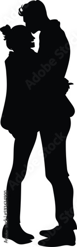 silhouette of boy kissing a girlfriend.