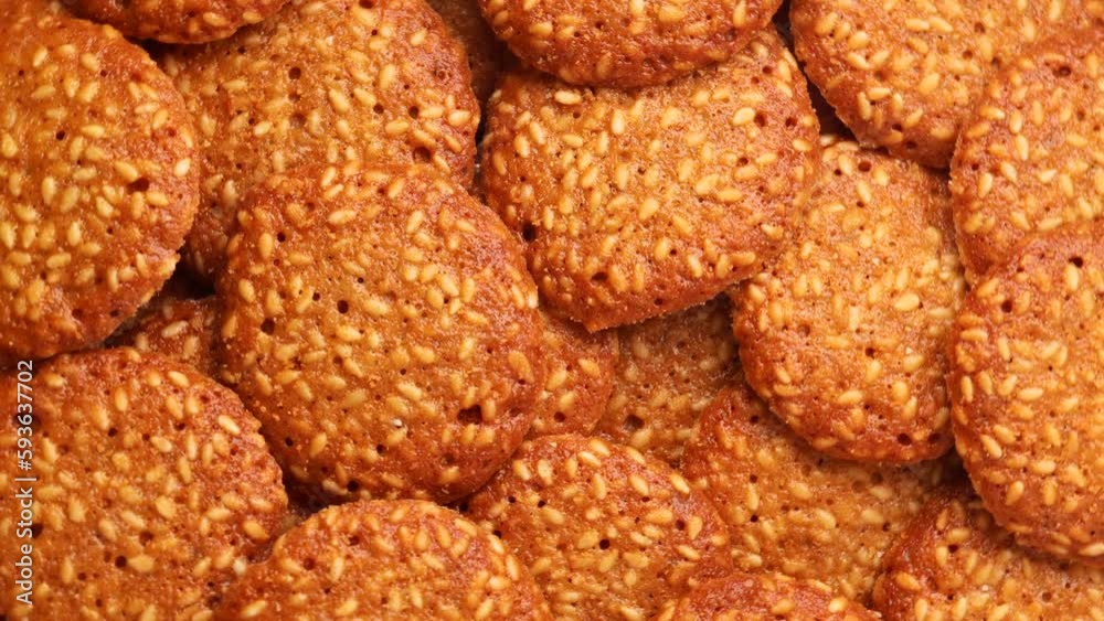 cookies with sesame seeds, rotation in circle. sesame cookies Turning. selective focus cookies with sesame seeds, rotation in circle. sesame cookies Turning. selective focus