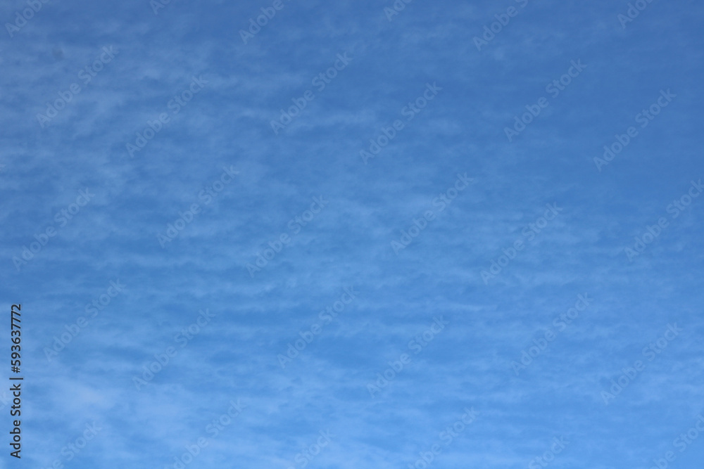 Full frame of pretty blue sky with soft scudding cloud formation