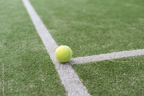 tennis ball on tennis grass court © Angelov