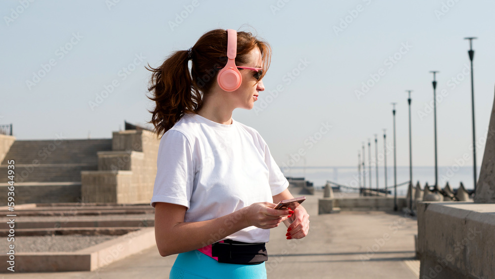Young woman jogging on city streets