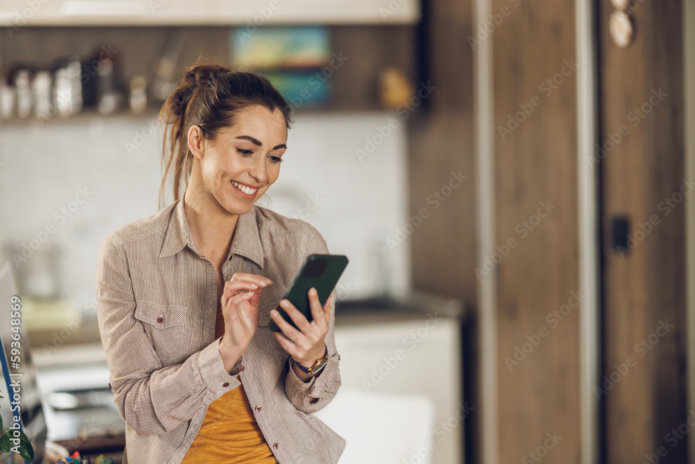 Fototapeta premium Woman Using Smartphone At Home