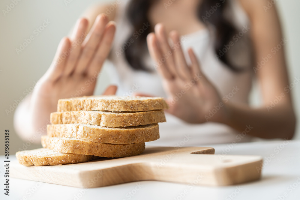 Foto de Gluten allergy, asian young woman hand push out, refusing to
