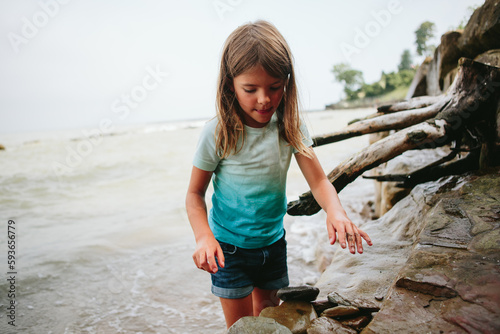 Girl frolics in water at beach