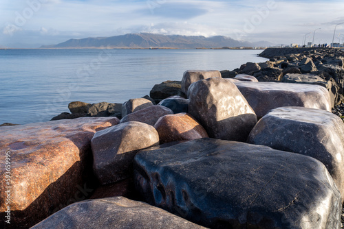 Reykjavik, Iceland: Shore Piece (Fjöruverk) conceptual art to celebrate the millennium by artist Sigurður Guðmundsson - polished boulders in the sea wall.
