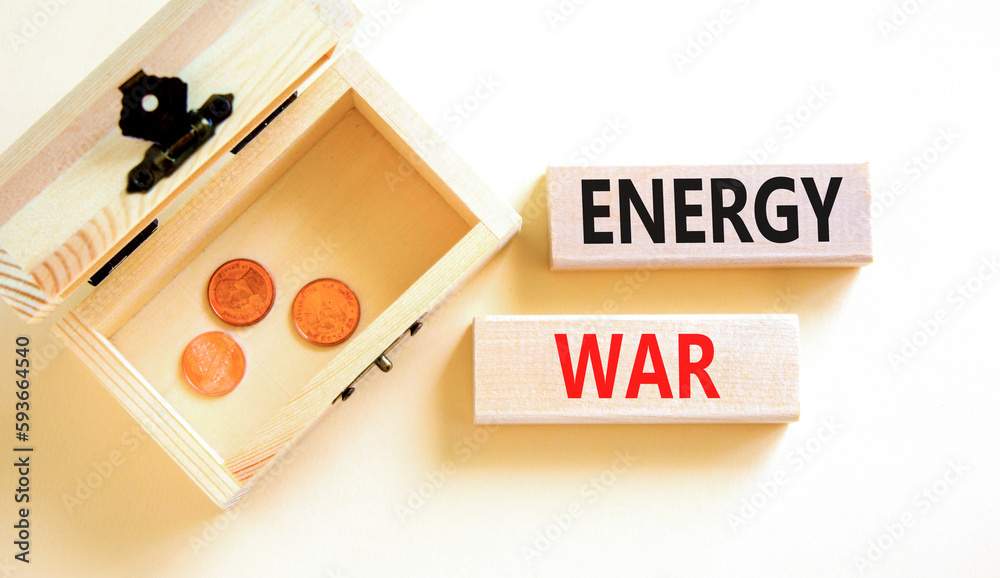 Energy war symbol. Concept words Energy war on beautiful wooden block. Beautiful white table white background. Wooden chest with coins. Business and Energy war concept. Copy space. Energy war symbol. Concept words Energy war on beautiful wooden block. Beautiful white table white background. Wooden chest with coins. Business and Energy war concept. Copy space.