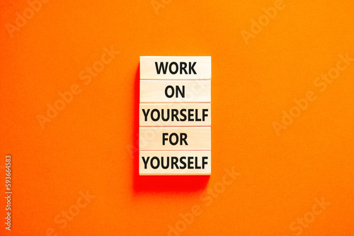 Work for yourself symbol. Concept words Work on yourself for yourself on wooden block. Beautiful orange table orange background. Business and work for yourself concept. Copy space.