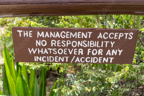Sign - The Management accepts no responsiblity for any incident or accident - posted at a hotel resort to avoid getting sued