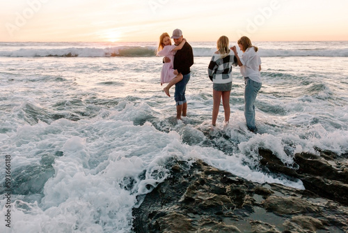 Happy Family with teenagers on the beach together photo