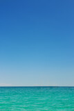 Beautiful idyllic seascape with blue sky. Clear sky and calm sea or ocean water surface background