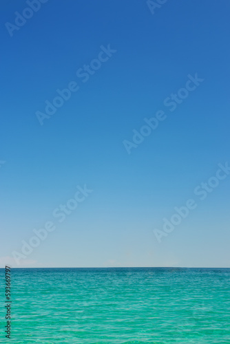 Beautiful idyllic seascape with blue sky. Clear sky and calm sea or ocean water surface background © Gray wall studio