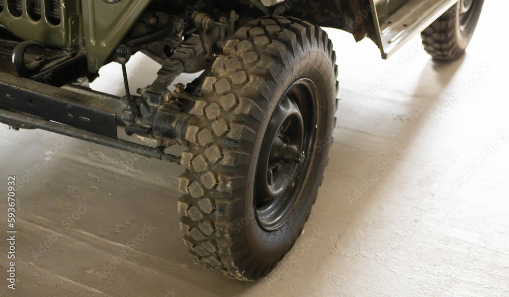 Part of the old soviet army car jeep. Restored retro car. Close-up Part of the old soviet army car jeep. Restored retro car. Close-up