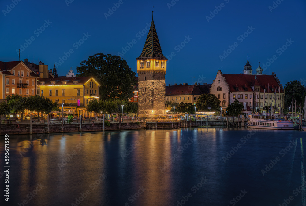 Night view of the picturesque port of Lindau with the Mangenturm tower., Bavaria, Germany