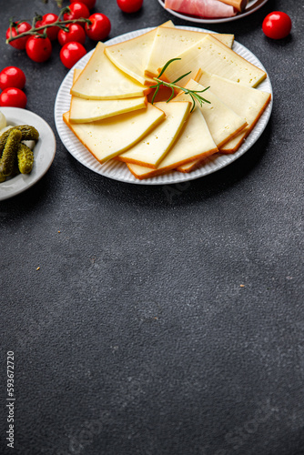 Fototapeta Naklejka Na Ścianę i Meble -  raclette cheese meal appetizer food meal food snack on the table copy space food background rustic top view