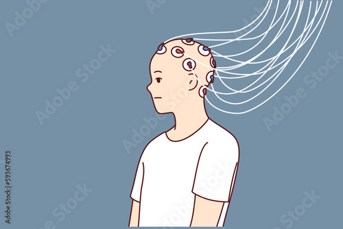 Man with electrodes connected to head to study brain activity and work of neurons or mind control. Wires connected to head of bald guy to develop neurotechnologies or create biorobots