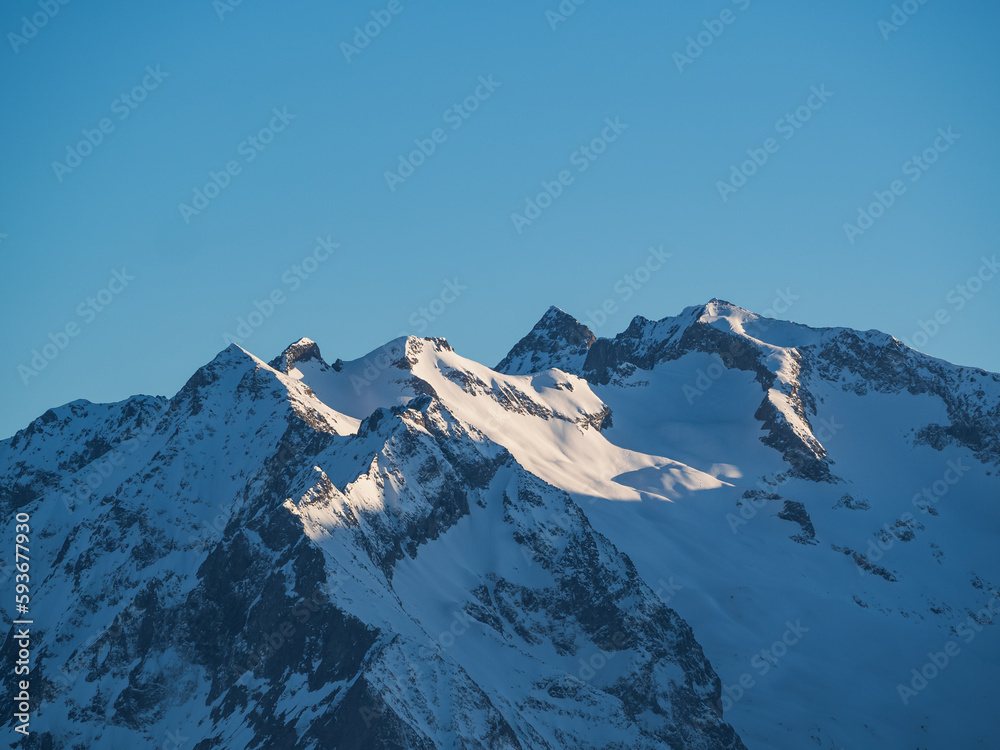 Obraz premium Blue morning sky over the French Alps mountains, Alpe d'Huez, France