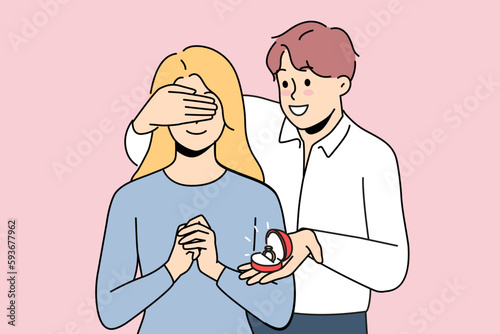 Loving man close excited woman eyes make marriage proposal. Smiling guy surprise girl with engagement ring. Weeding and relationship. Vector illustration. 