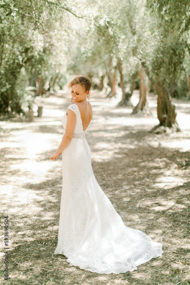 Bride Poses in Olive Tree Grove Bride Poses in Olive Tree Grove