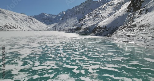 Aerial view of Mattmark dam in winter time in the swiss mountains photo