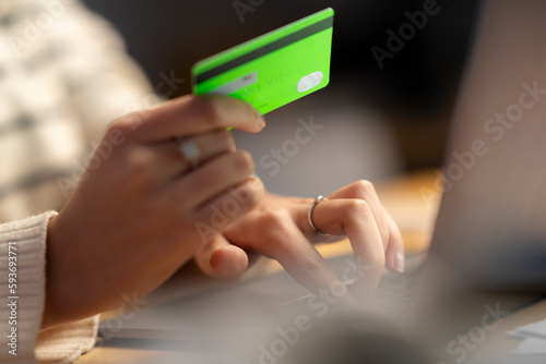 Woman paying with credit card on internet