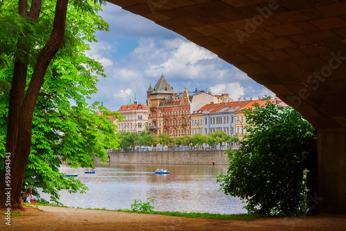 View of Prague historical center and riverfront from Legion Bridge arch on Strelecky Island public park photo