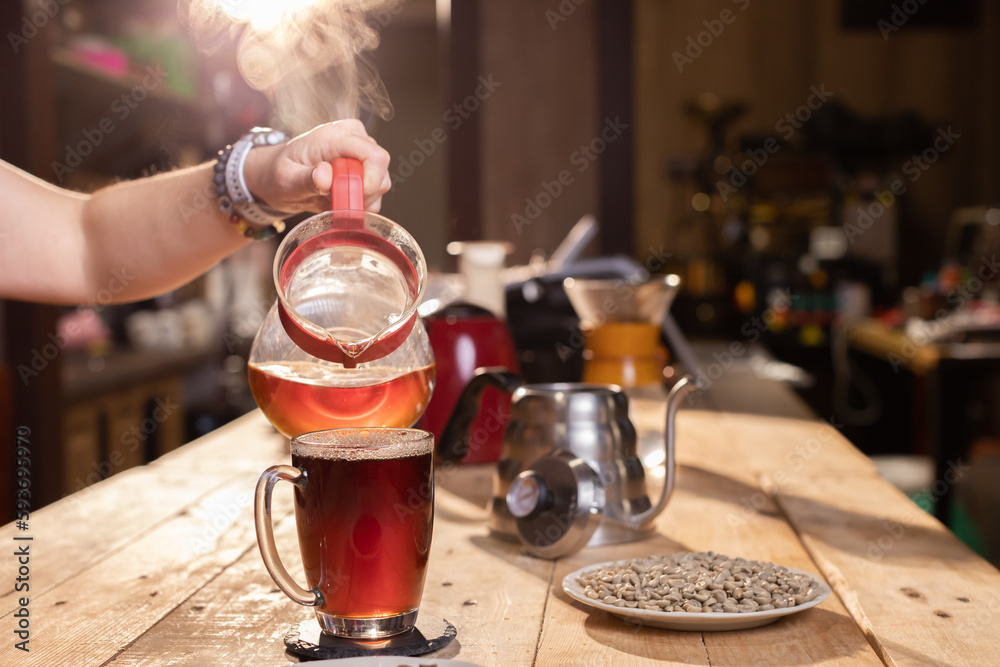 Professional barista preparing coffee. Young woman making coffee. Alternative ways of brewing coffee. Coffee shop concept